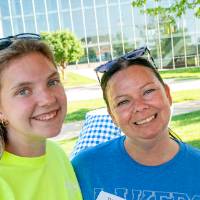 Tricia Augdahi '02 and Anna Harmon smile at the camera